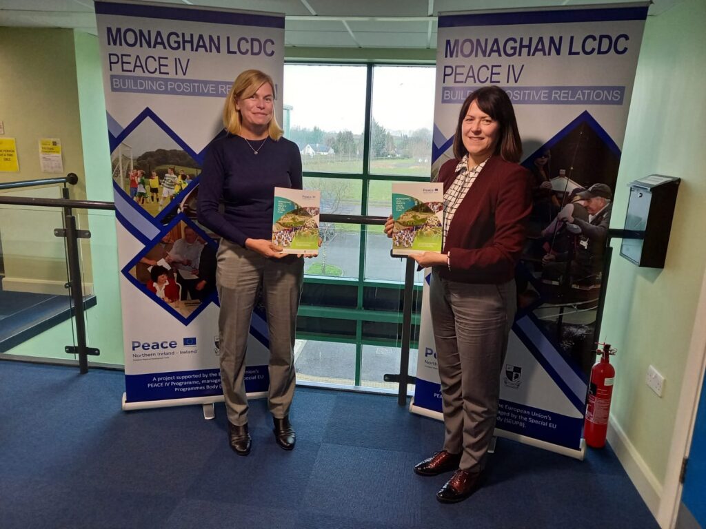 Chair of Monaghan Peace IV Partnership, Patricia Monahan, and Peace Programme Manager, Nicola Payne closing the Peace IV Local Action Plan in Monaghan with a collection of photos and case studies