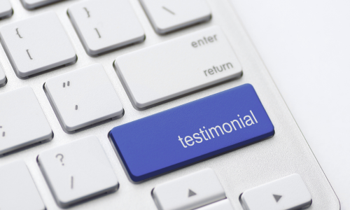 Images of keyboard with Testimonials written on it